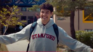 Noah Centineo smiling, wering a Stanford hoodie in XO, Kitty