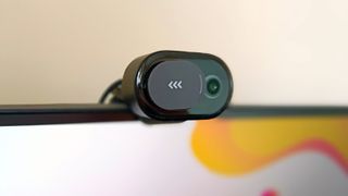 A black Microsoft Modern Webcam perched on a monitor