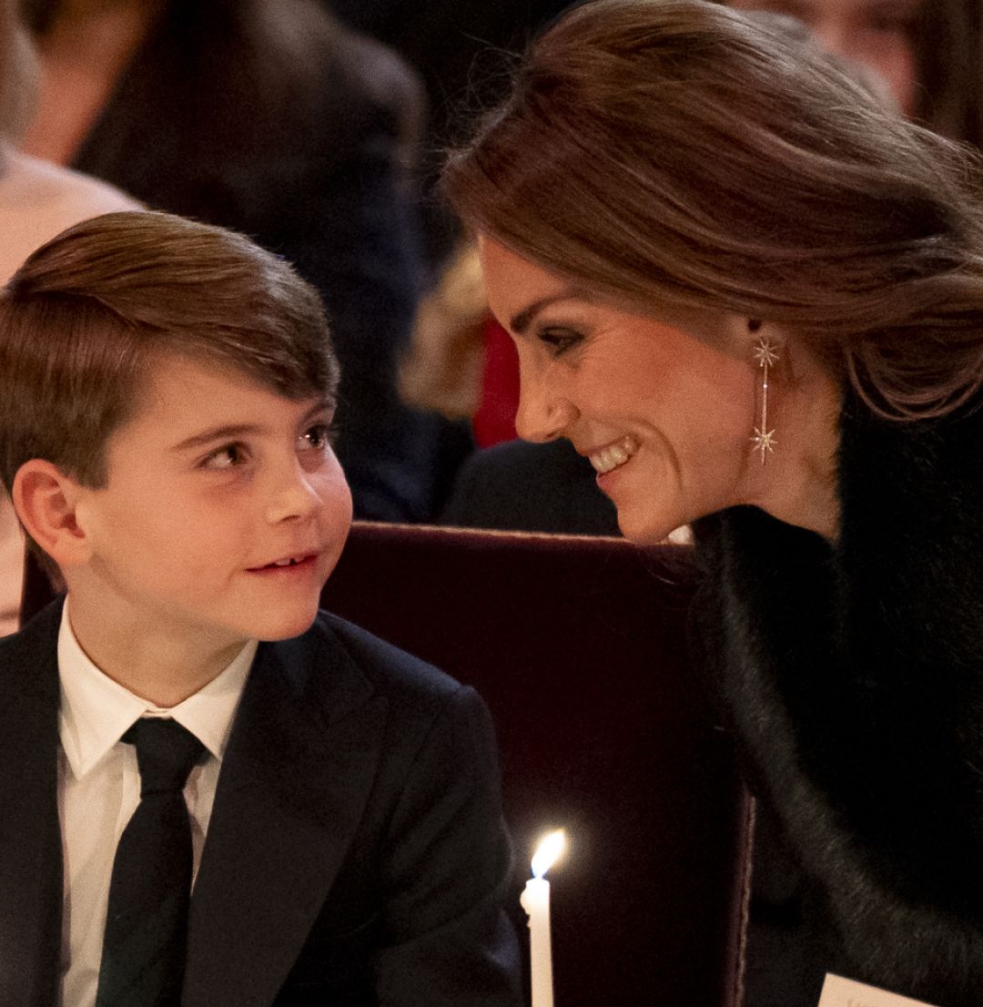Prince Louis and Princess Kate holding candles at the Together at Christmas 2025 concert