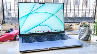 The MacBook Pro 2021 (14-inch) open on a desk