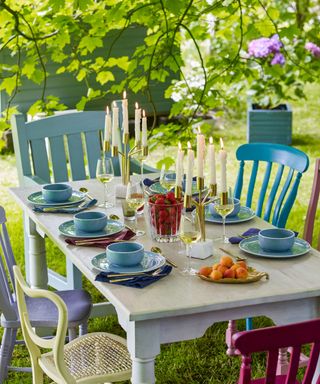 brightly painted garden table with candelabra