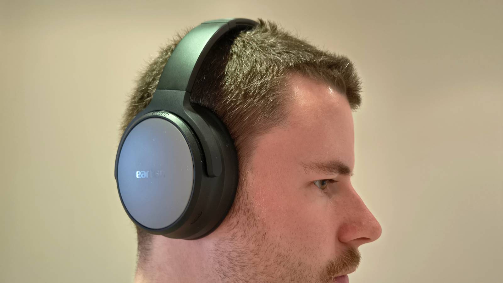 The Earfun Tune Pro on a man's head.