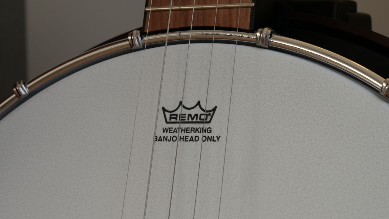 A photograph of a banjo head taken on the Lumix G97. Taken at 1/15 sec, the text on the banjo head is distinguishable.