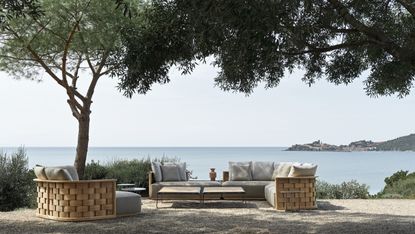 Molteni&C outdoor furniture beside trees and water