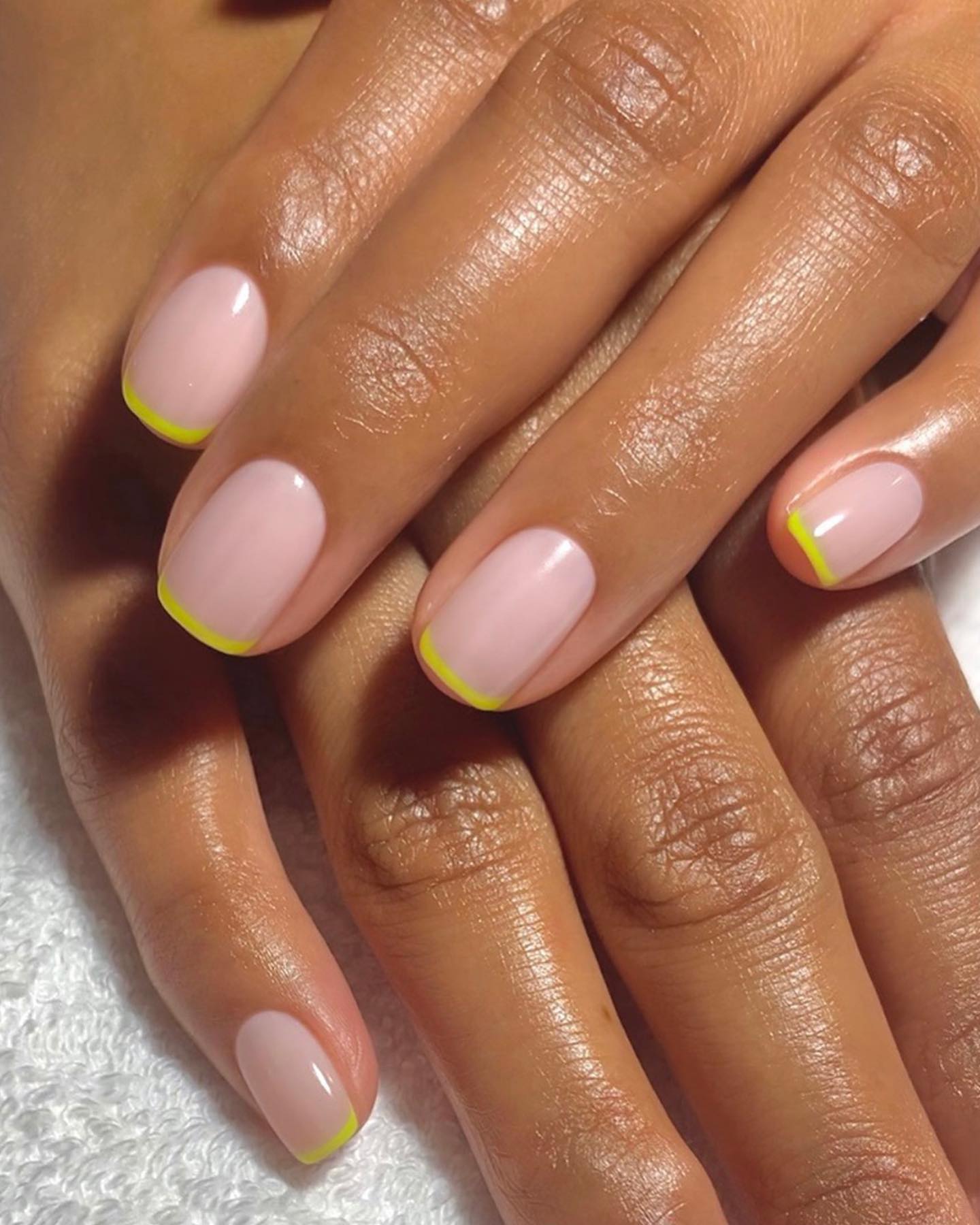 Short squoval nails with pastel yellow French tips
