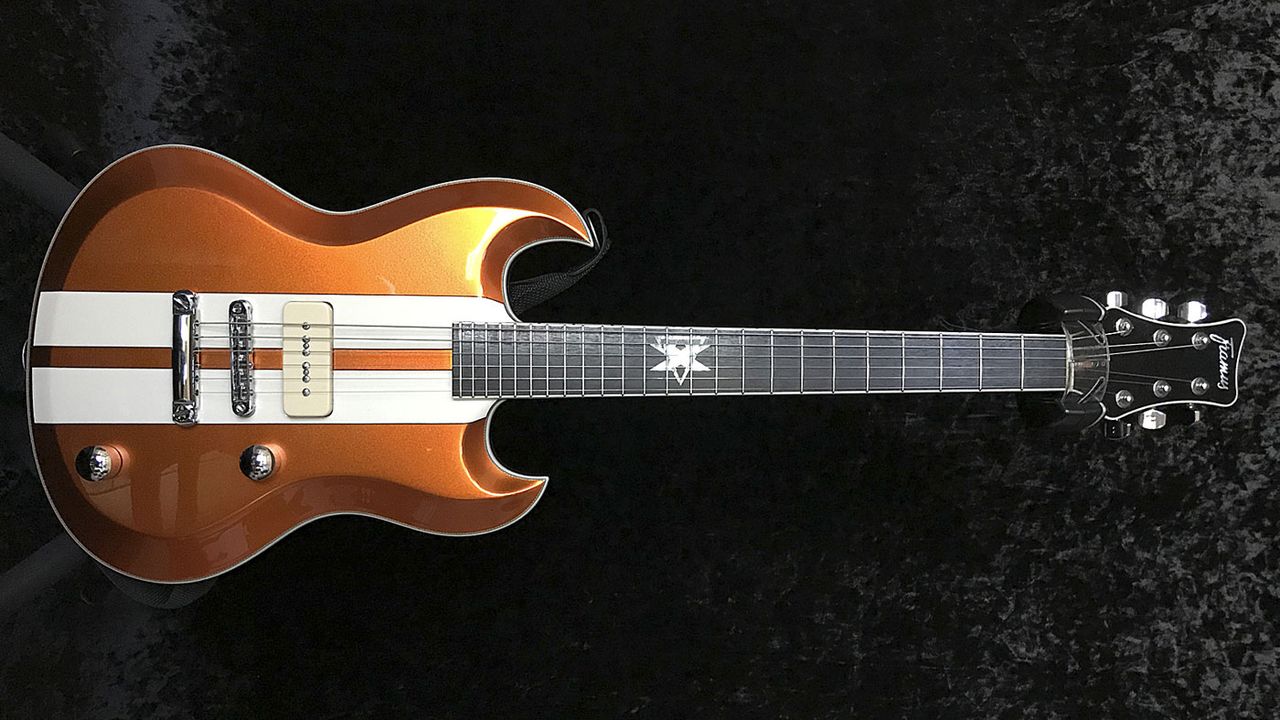 This metallic tangerine-finish model with racing stripes is fitted with Arcane&rsquo;s PX90 pickups, custom wound for Phil.