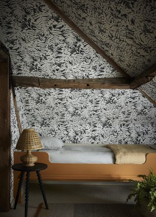The cocooning effect of applying wallpaper on all the walls, including the ceiling