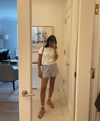 @nicoleakhtarzad summer shorts and tee outfit mirror selfie.