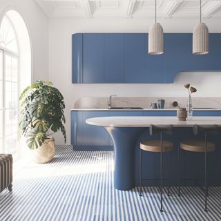 white kitchen with blue stripped flooring and blue worktop