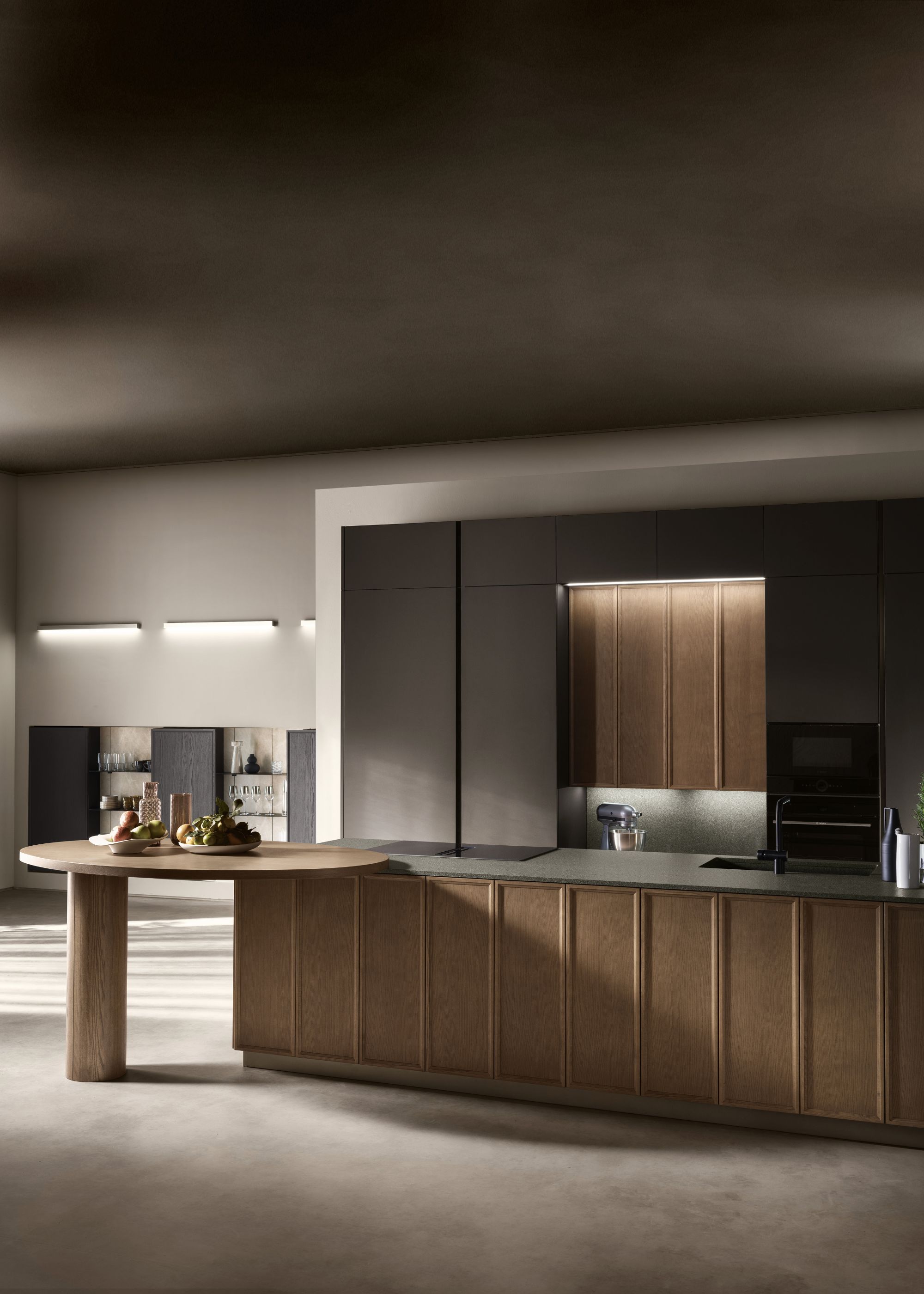A kitchen countertop with a extra curved table/counter on the edge.
