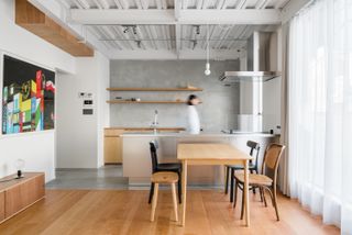 kitchen and dinning area with large windows at House in Tamatsukuri