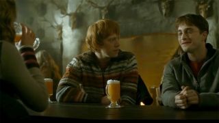 Harry, Ron and Hermione visit the Three Broomsticks for some Butterbeer. 