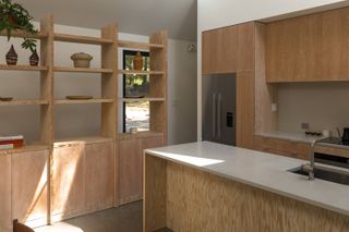 Wooden kitchen inside forest retreat in Canada