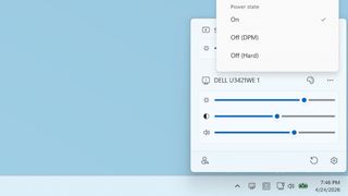 A promotional image for Microsoft PowerToys Power Display feature, showing the tool pop-up on a Windows desktop