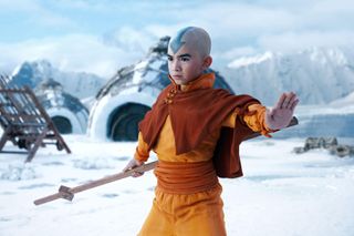 aang does an airbending trick over a snowy landscape in Avatar: The Last Airbender