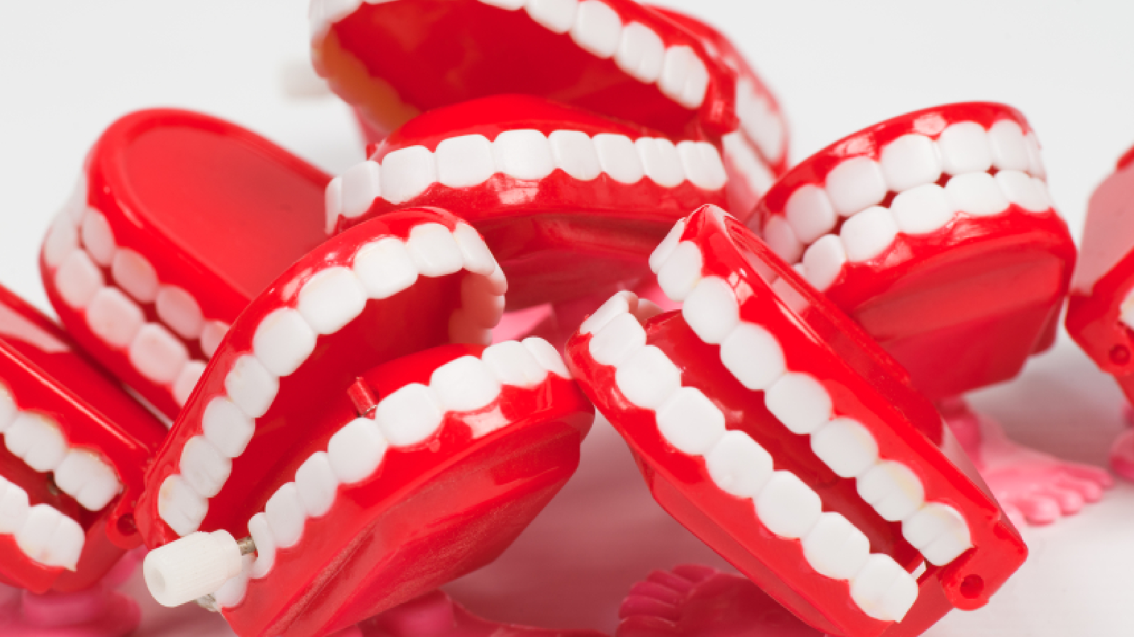 plastic teeth piled up with plain background