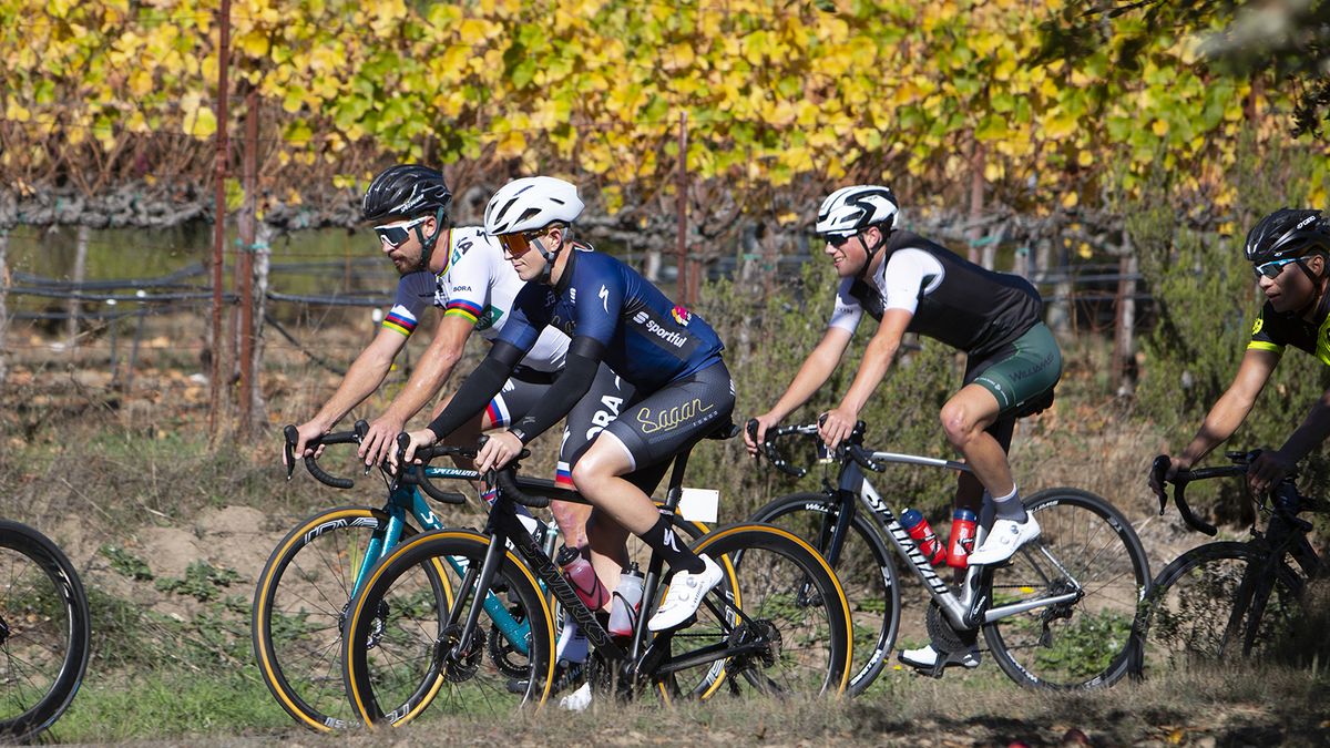 Peter Sagan rides alongside participants through the vineyards