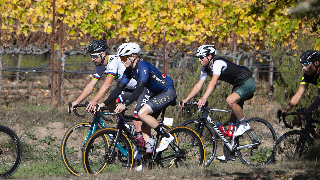 Peter Sagan rides alongside participants through the vineyards
