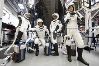 The four astronauts of SpaceX's Crew-3 mission for NASA strike a pose in their launch suits ahead of their Oct. 31, 2021 launch. They are: (from left) ESA astronaut Matthias Maurer, mission specialist; NASA astronauts Tom Marshburn, pilot; Raja Chari, commander; and Kayla Barron, mission specialist.