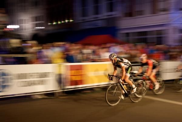 The men's pro field whips past the crowds