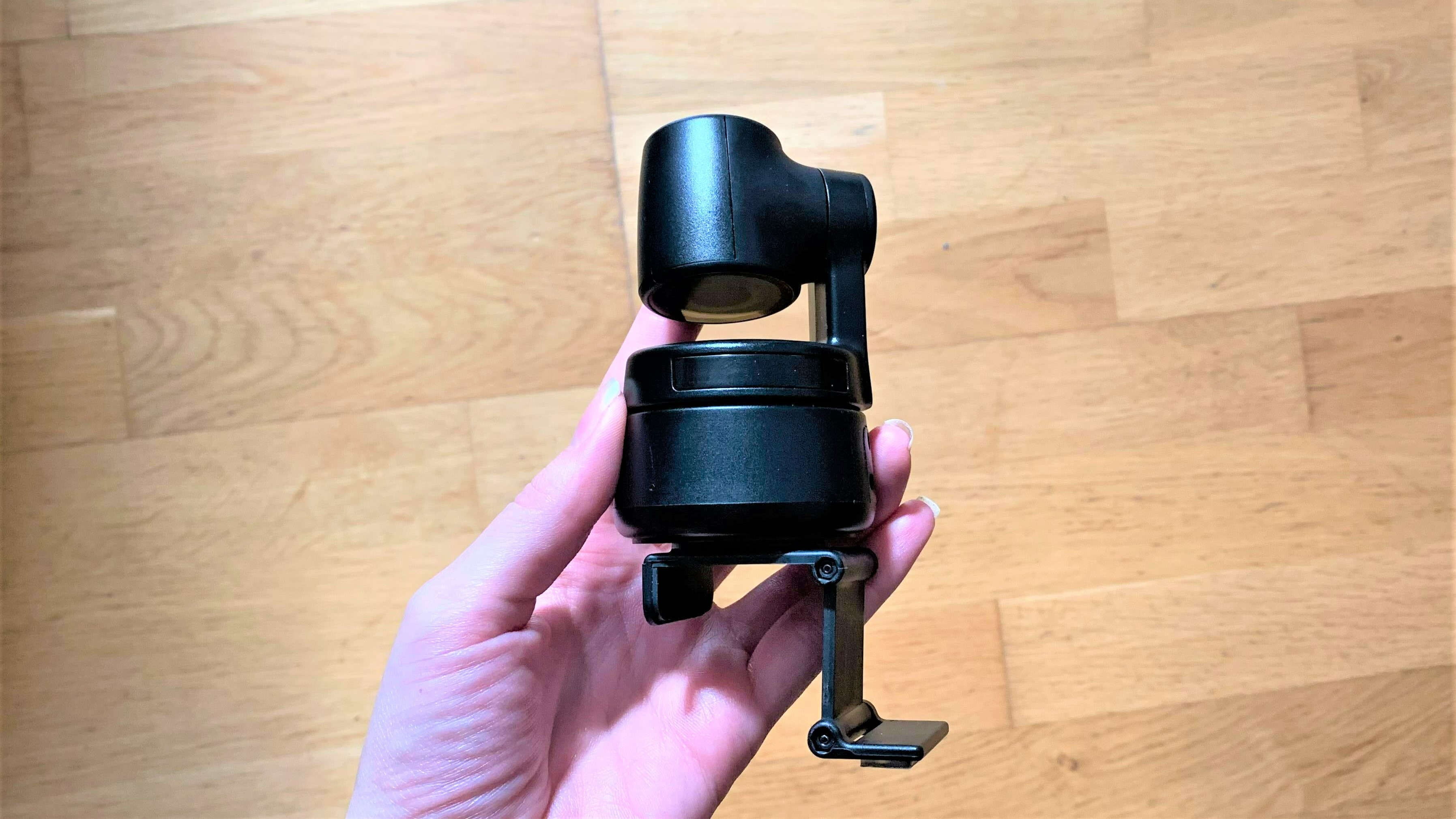 Obsbot Tiny 4K in hand with the clip attached