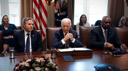 President Joe Biden flanked by Secretary of State Antony Blinken and Defense Secretary Lloyd Austin