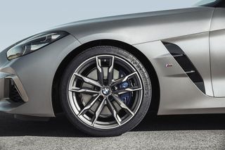 Side view of tyres and silver rim of BMW motor