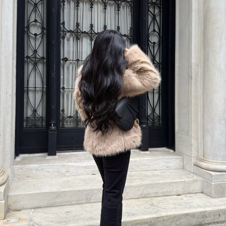 Creator @leatngu wearing a winter coat and Dior handbag with long, glossy, wavy hair