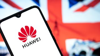 Smartphone displaying Huawei logo, UK flag in background