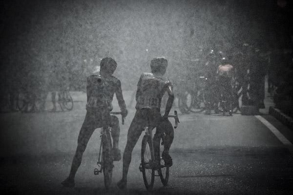 A couple of riders get some relief from the heat in Malaysia after stage one in Langkawi.