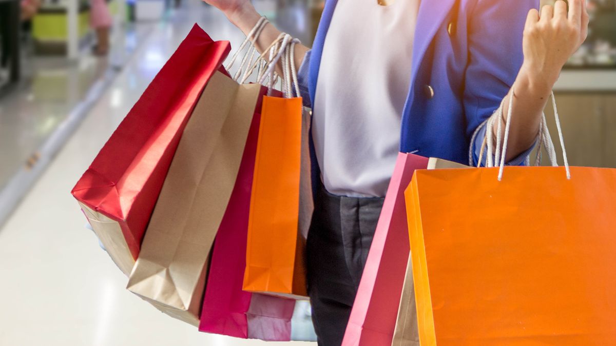 A woman carrying shopping bags in the mall