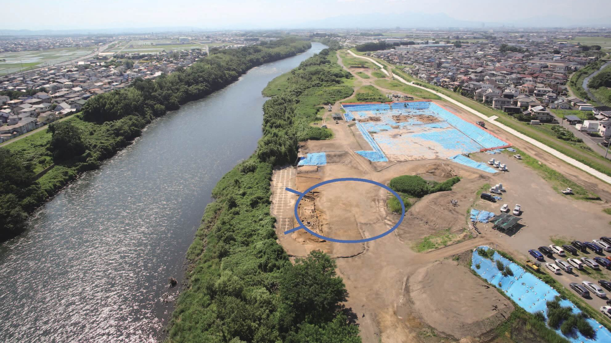 an aerial view of an archaeological site near a river