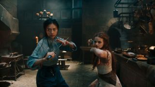 Veronica Ngo and Joey King stand with swords at the ready in The Princess.