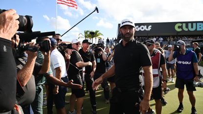 Dustin Johnson celebrates with the crowd after the 2022 LIV Golf Team Championship in Miami