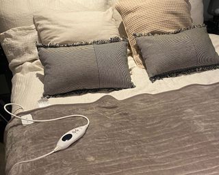 Best electric blanket Louises in grey on bed