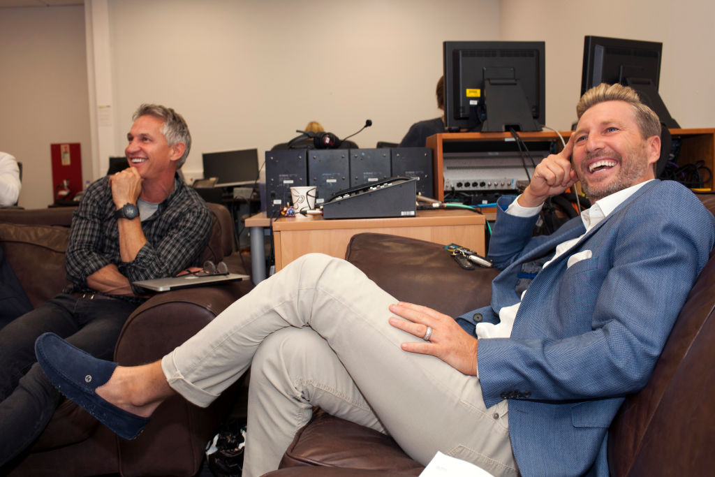 Gary Lineker and Robbie Savage watch the Saturday football premiership matches at the BBC