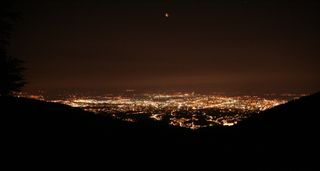The city of Zagreb, Croatia shines under an eerie red moon during the total lunar eclipse of June 15, 2011. This photo was taken from Sljeme mountain in Croatia by a skywatcher Phillip Bailey.