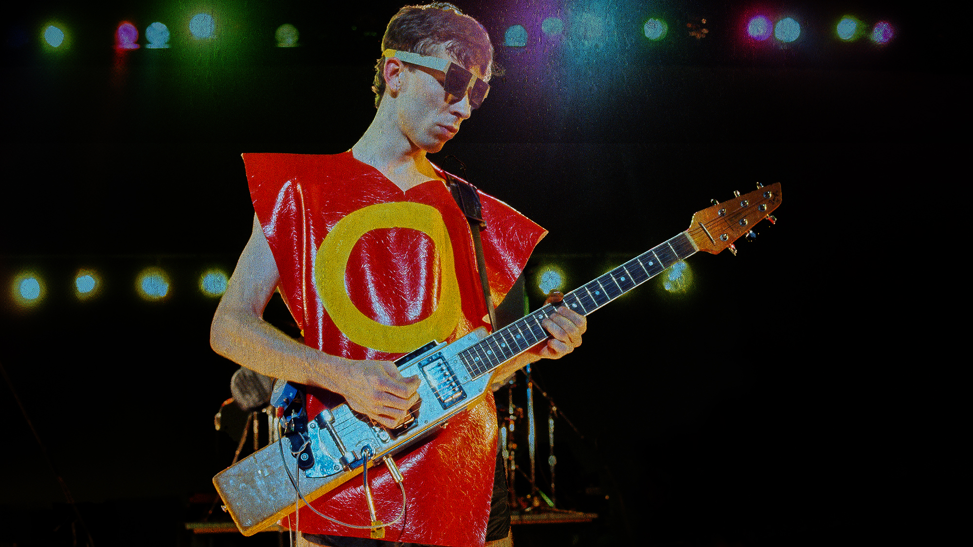 Bob Mothersbaugh and Devo perform at the Berkeley Community Center in Berkeley, California on December 28, 1979. He's playing a rare La Baye 2x4 electric guitar 