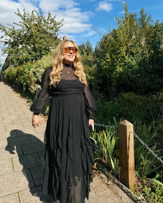 Influencer wears a polka dot dress.