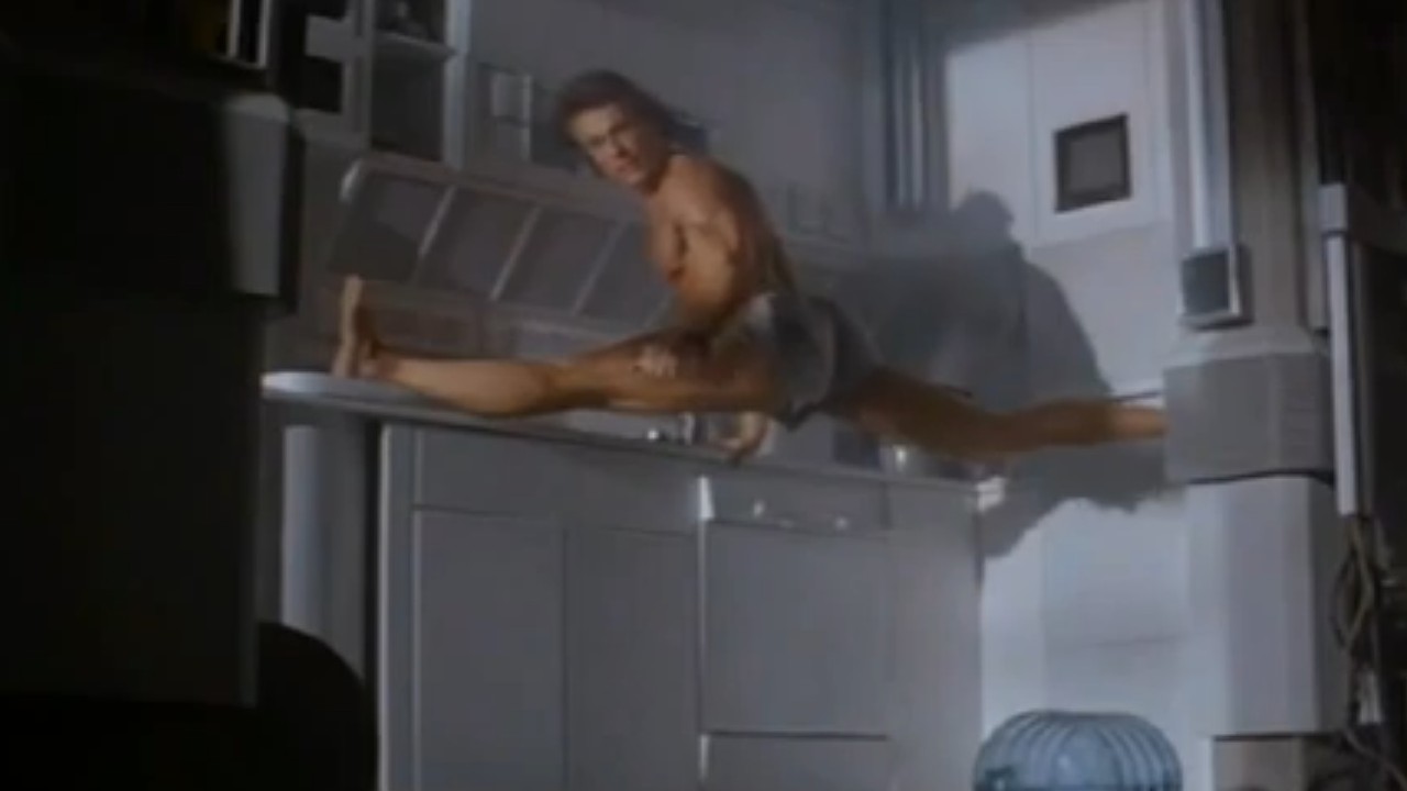 Jean-Claude Van Damme doing a split on counters in Timecop