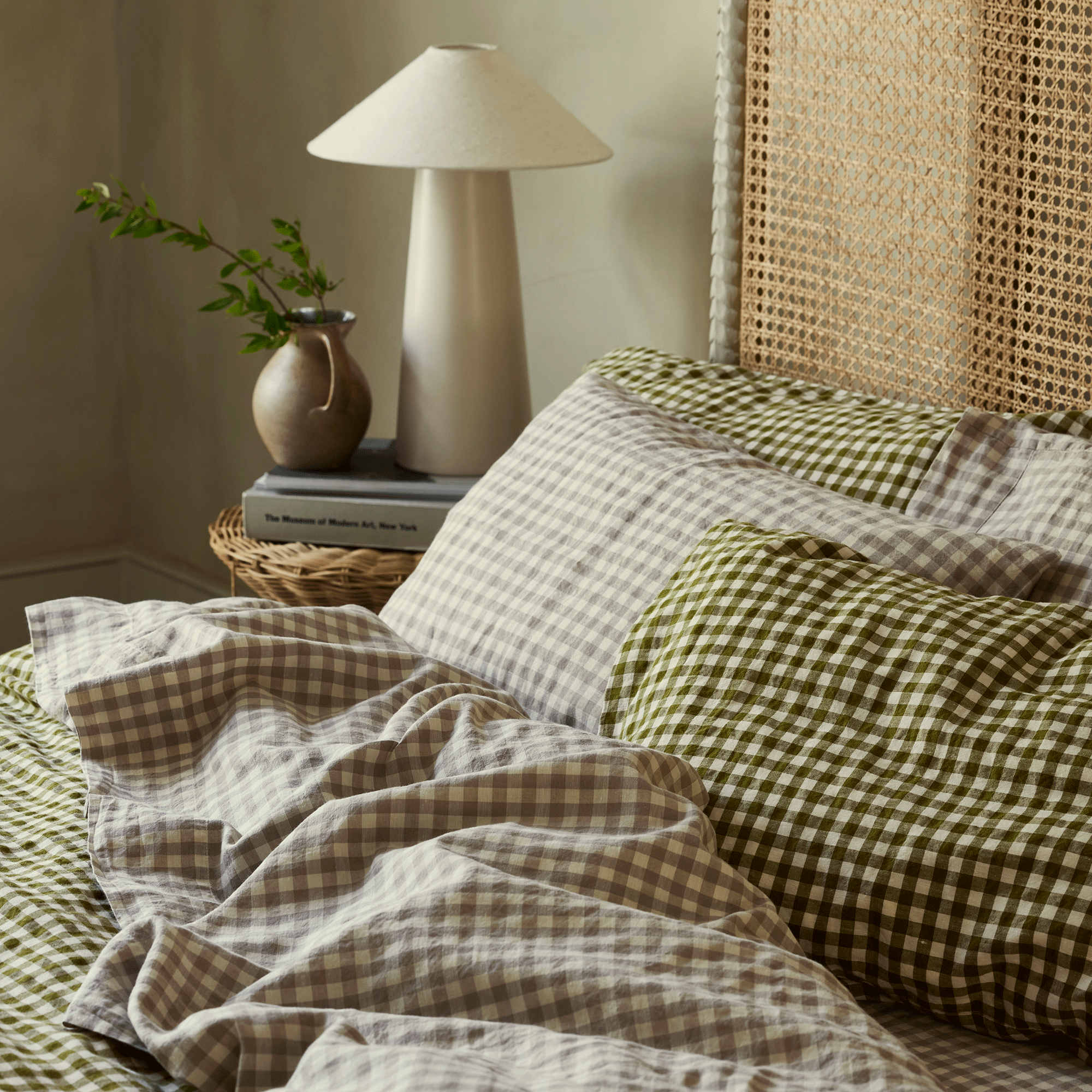 Botanical green gingham bedding in a neutral bedroom