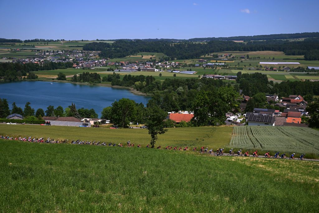 NOTTWIL SWITZERLAND JUNE 12 A general view of the peloton passing through a landscape during the 86th Tour de Suisse 2023 Stage 2 a 1737km stage from Beromnster to Nottwil UCIWT on June 12 2023 in Nottwil Switzerland Photo by Dario BelingheriGetty Images
