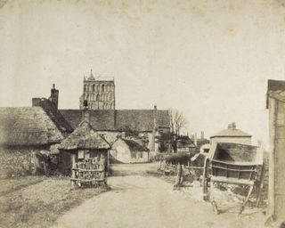 Sepia image of ramshackle farmyard