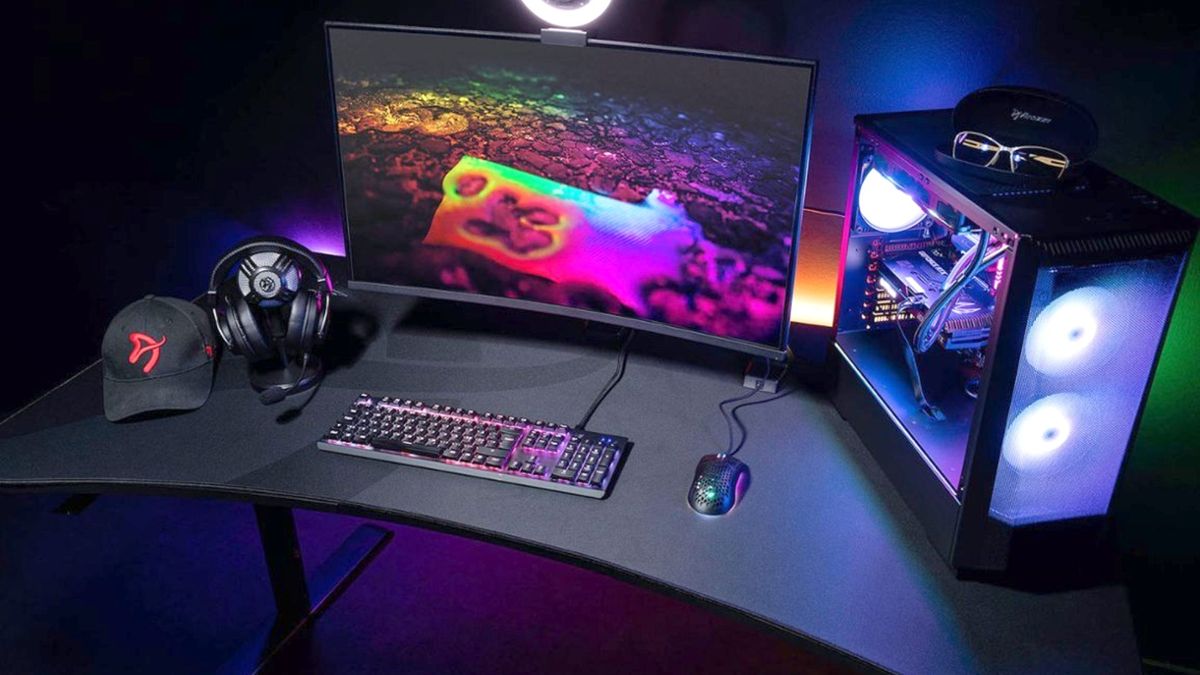 Arozzi’s Arena Ultrawide gaming desk with monitors, keyboard, and mouse on top