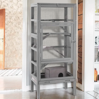 A tall grey cage for small pets
