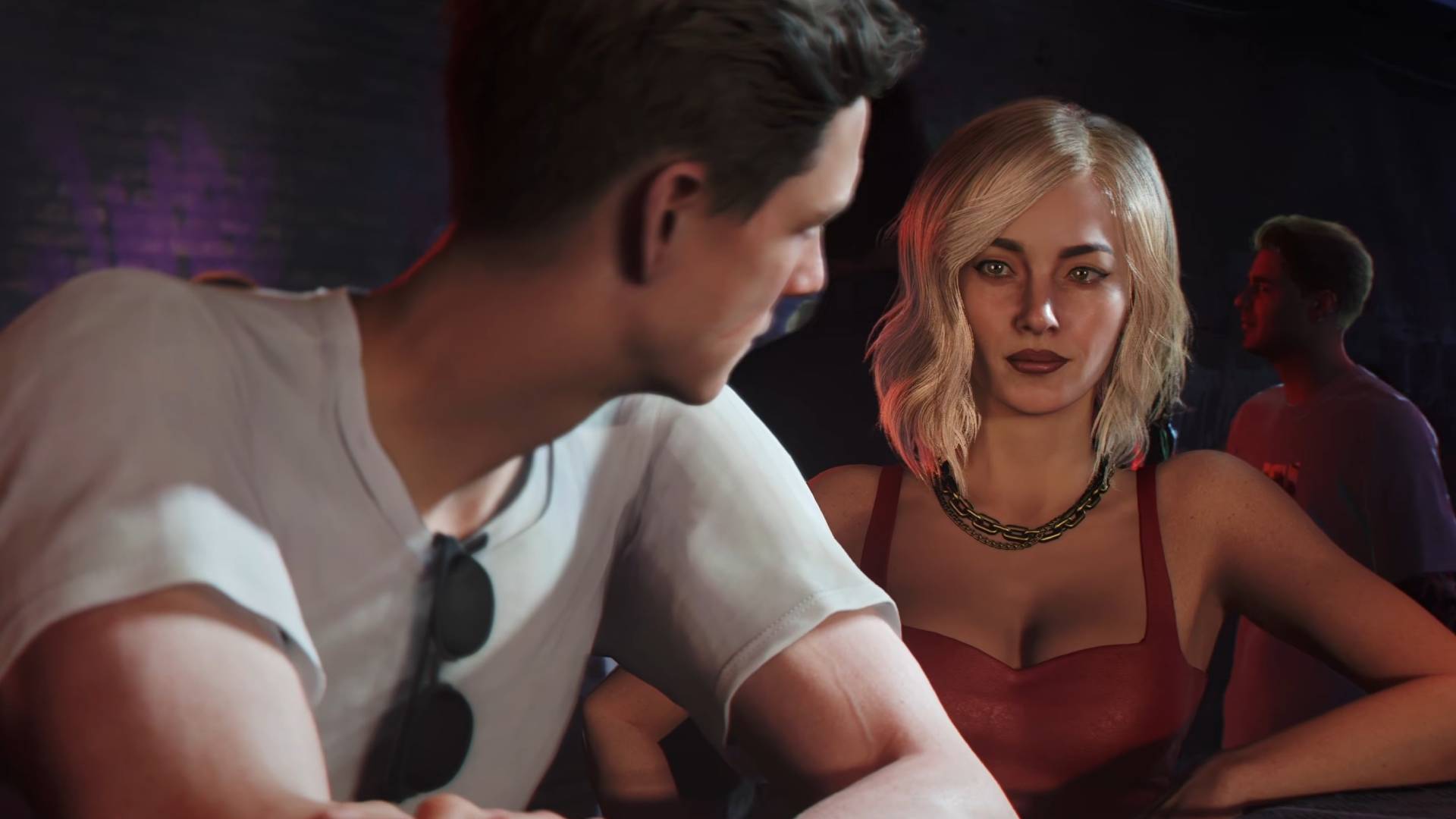 007 First Light James Bond talking to blonde woman in red dress at a bar