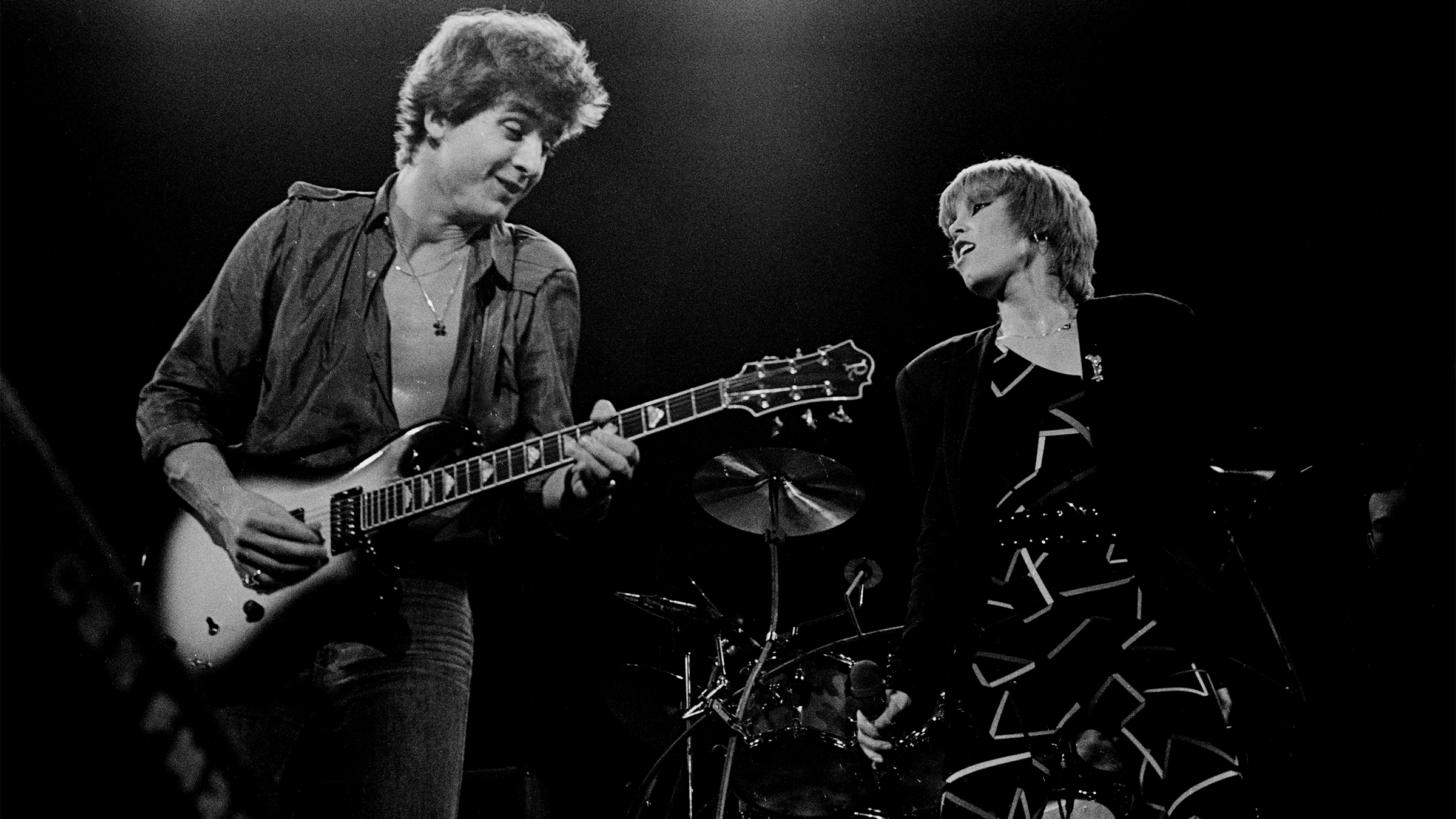 American Rock musicians Neil Giraldo, on guitar, and singer Pat Benatar perform onstage at the Capitol Theatre, Passaic, New Jersey, October 10, 1980.