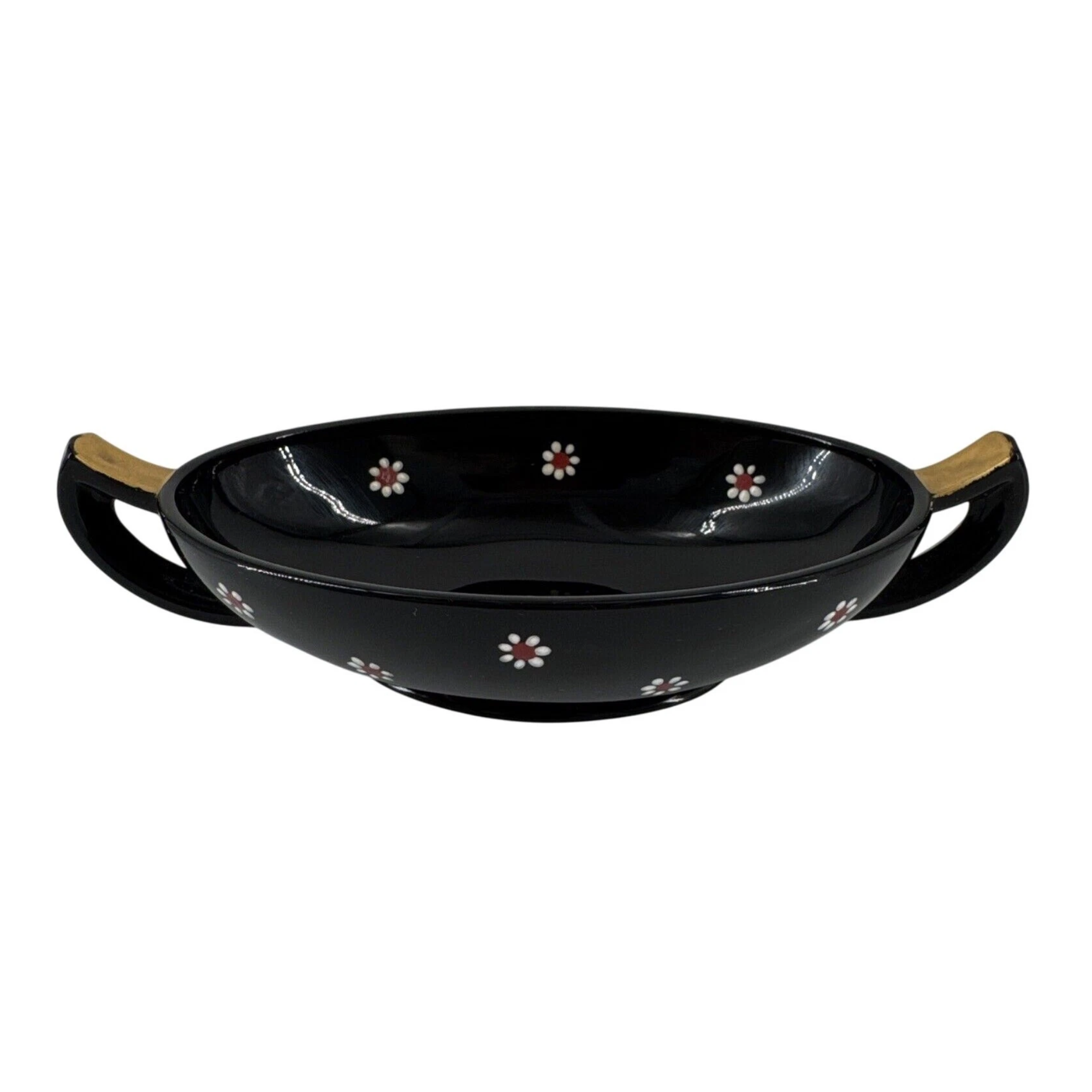 decorative black bowl with two handles and small decorative flowers
