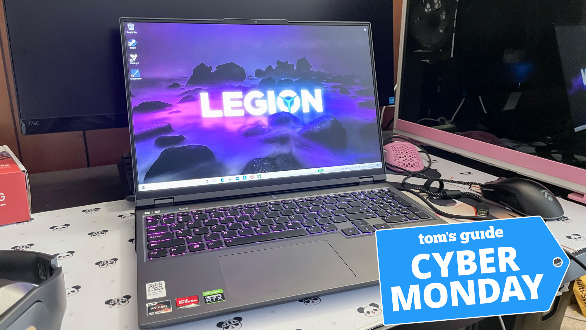 lenovo legion 5 pro sitting on desk with display on and cyber monday tag