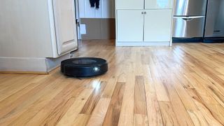 Roomba J9+ Combo robot vacuum and mop shown on floor